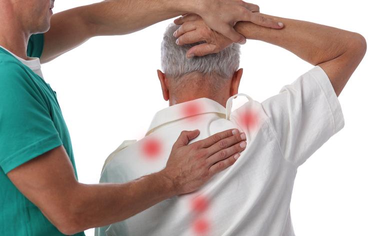 Male patient with multiple trigger points on his back and neck Male patient with multiple trigger points on his back and neck