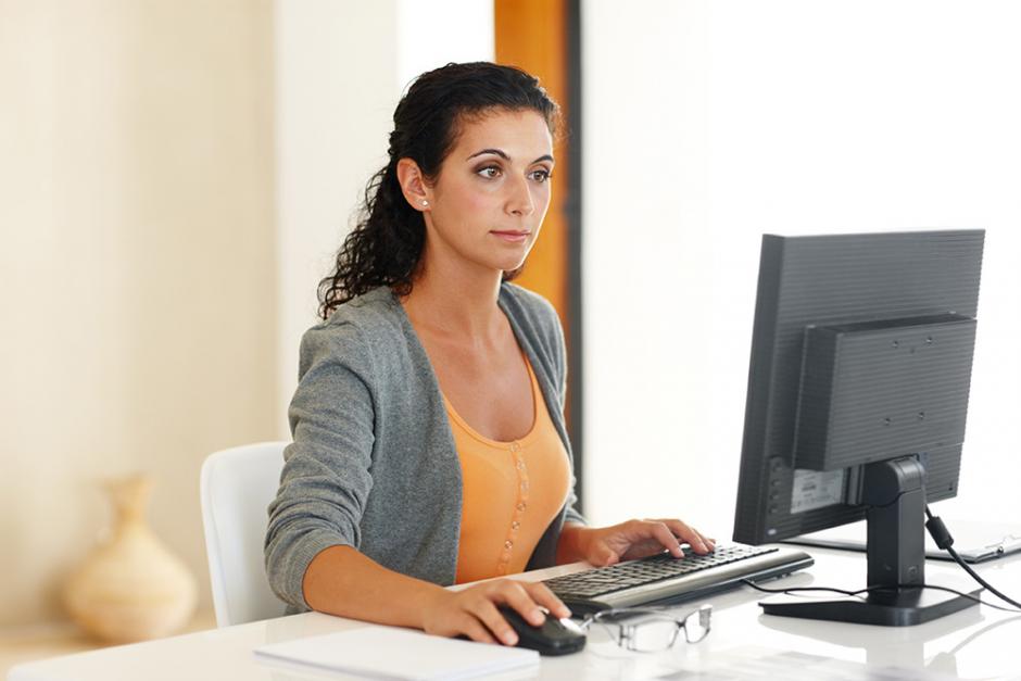 Female working on laptop at home Female working on laptop at home