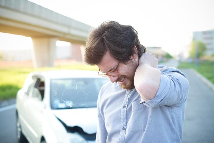 Whiplash injury with neck pain Man with whiplash injury after road traffic accident