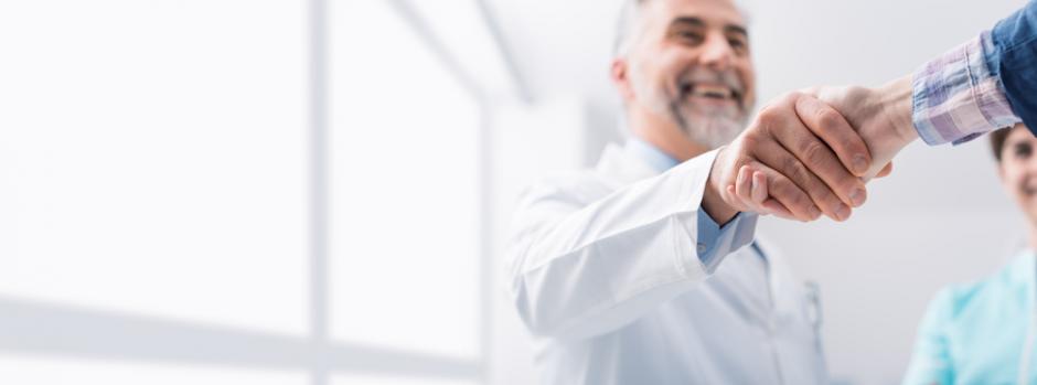 Handshake Doctor and patient congratulatory handshake