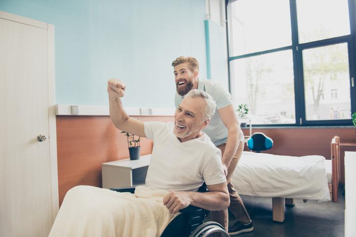 Post-surgical rehabilitation Man receiving physio rehab after orthopaedic surgery