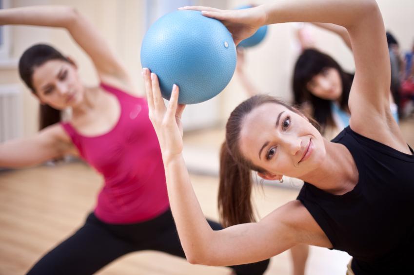 Pilates exercise ball Group of people doing pilates with exercise ball